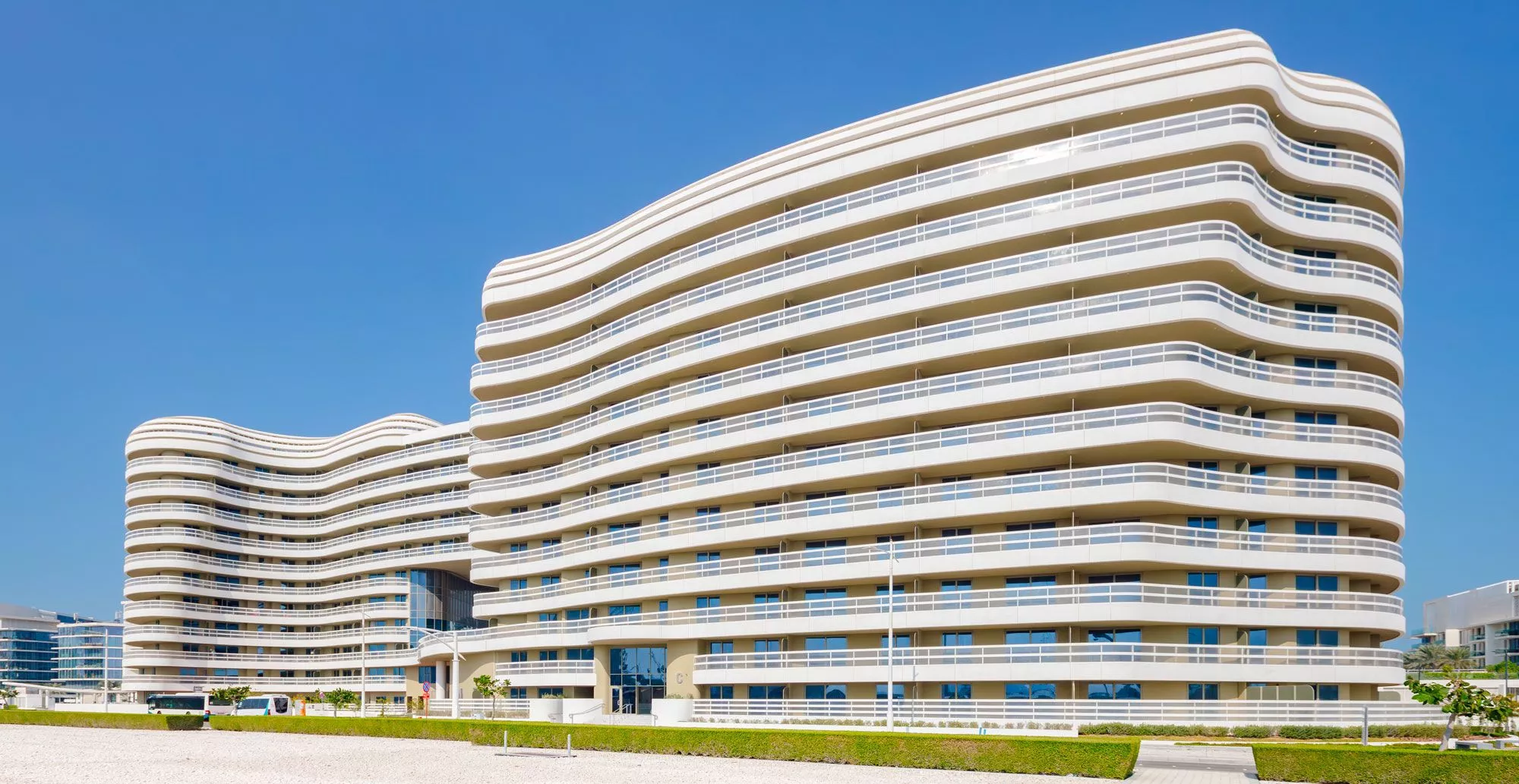 Landscaped gardens and walking paths creating a serene environment at Ajwan Towers, Saadiyat Island.