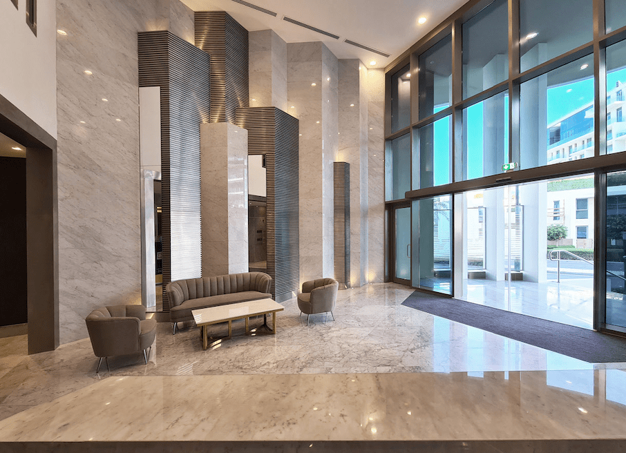 Spacious living room with floor-to-ceiling windows and sea views at Ajwan Towers, Saadiyat Island, Abu Dhabi.